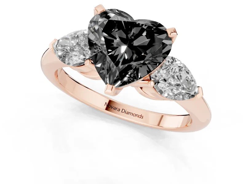 Fancy Black Three-Stone Heart Cut Diamond Ring Set in Rose gold with Pear Side Stones and Prong Setting