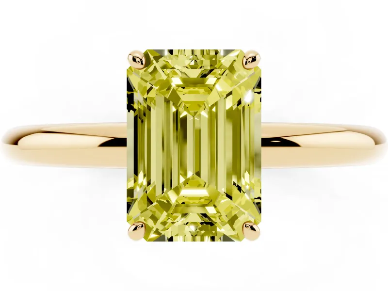 Fancy Yellow Emerald Cut Diamond Solitaire Ring Set in Yellow gold with Prong Setting on a Polished Plain Band