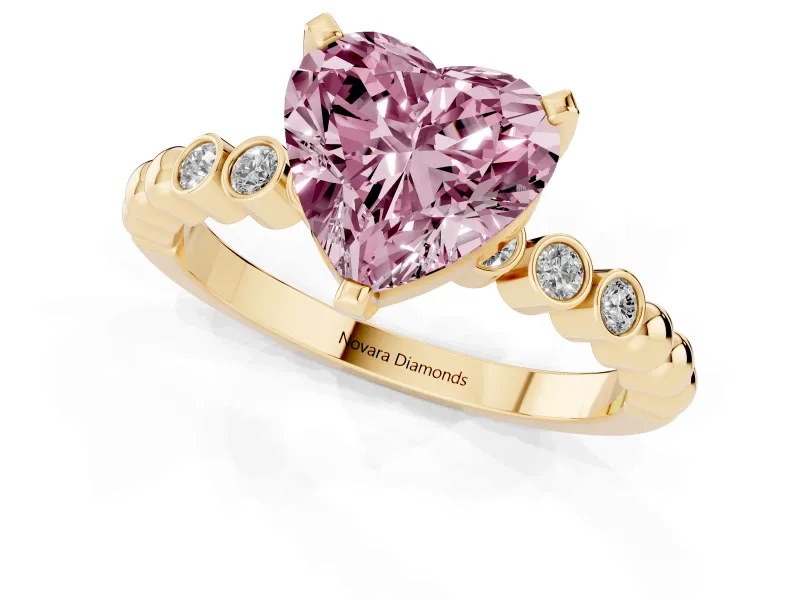 Fancy Pink Heart Cut Diamond Solitaire Engagement Ring Set in Yellow gold with Bezel Accents on Beaded Band