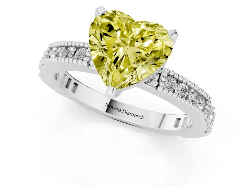Fancy Yellow Heart Cut Diamond Solitaire Ring Set in Platinum with Slim Pavé Band and Prong Setting