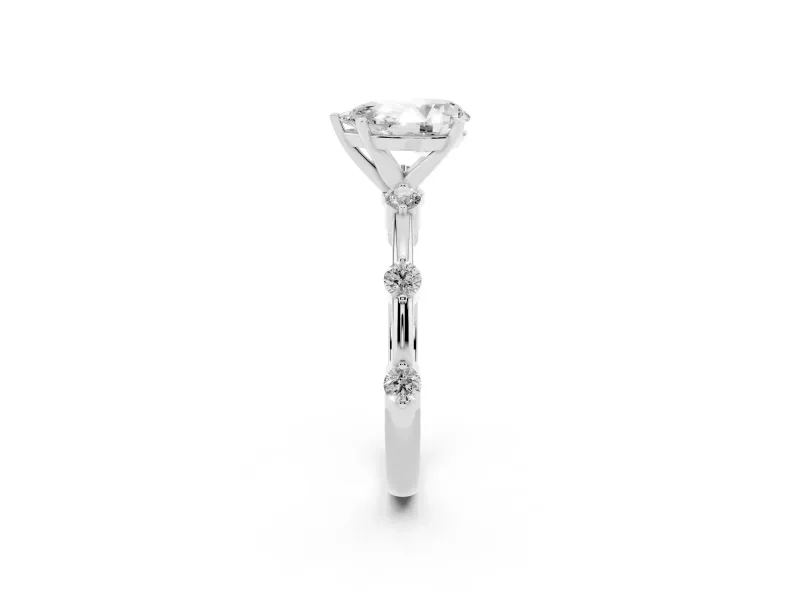 Pear Cut Diamond Solitaire Ring Set in Platinum with Bezel Set Side Stones and Prong Setting