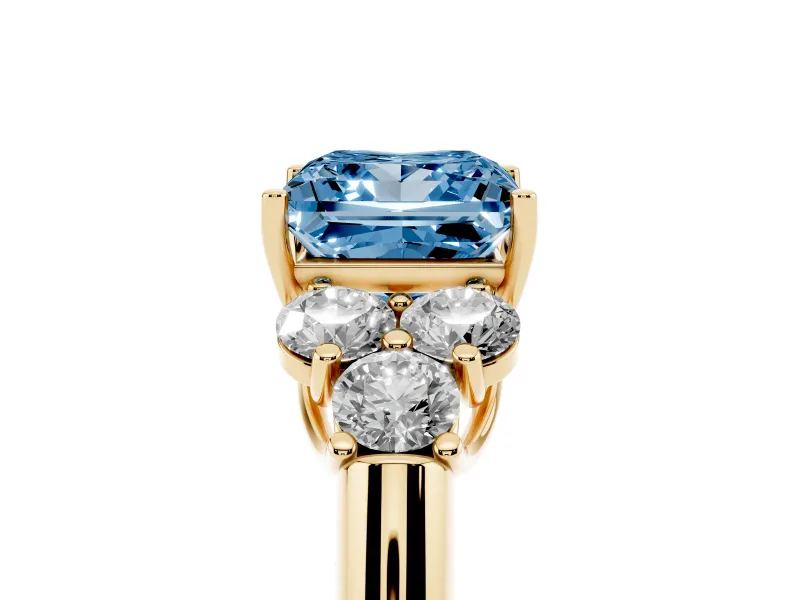 Fancy Blue Princess Cut Diamond Cluster Ring Set in Yellow gold with Round Accent Stones and Prong Setting on a Plain Band