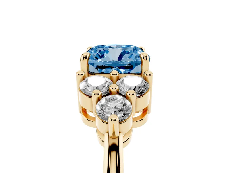 Fancy Blue Cushion Cut Diamond Solitaire Ring Set in Yellow gold with Cluster Accents on Each Side