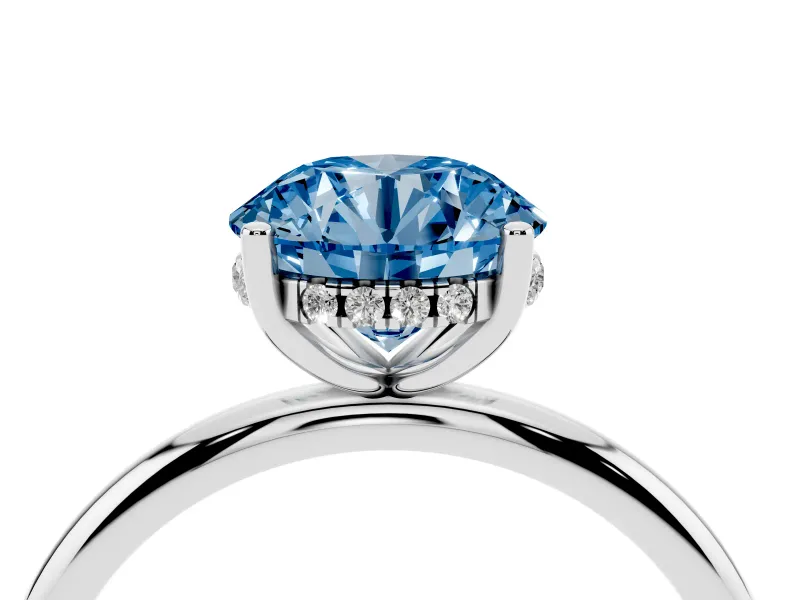 Fancy Blue Round Cut Diamond Solitaire Engagement Ring Set in White gold with Prong Setting and Polished Band