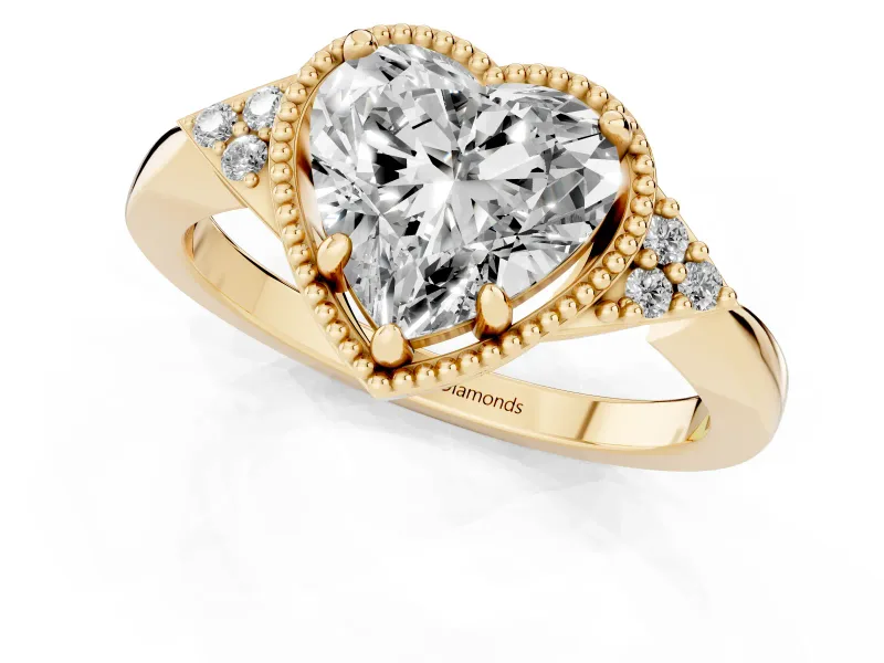 Heart Cut Diamond Milgrain Solitaire Ring Set in Yellow gold with Tapered Pavé Band and Prong Setting