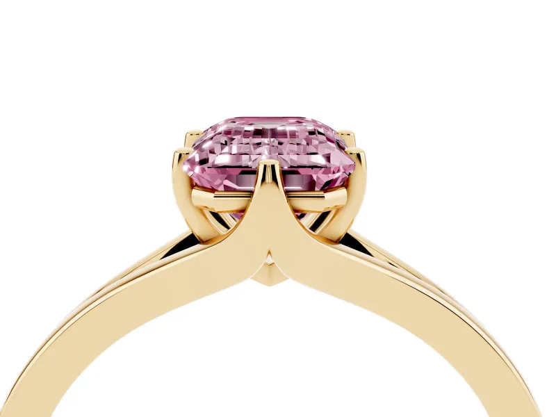 Fancy Pink Emerald Cut Diamond Solitaire Ring Set in Yellow gold with Polished Tapered Band and Prong Setting