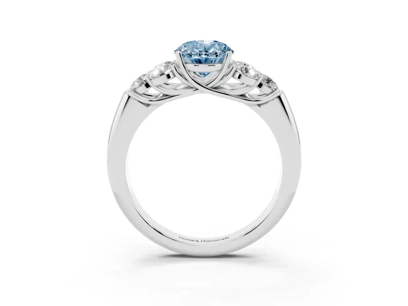 Fancy Blue Oval Cut Diamond Cluster Ring Set in White gold with Round Accent Stones and Prong Setting on a Plain Band
