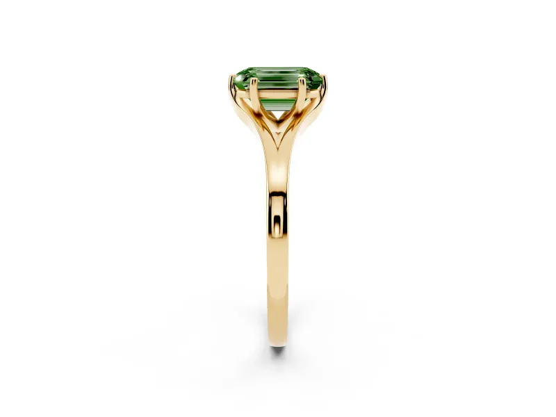 Fancy Green Emerald Cut Diamond Solitaire Ring Set in Yellow gold with Polished Tapered Band and Prong Setting