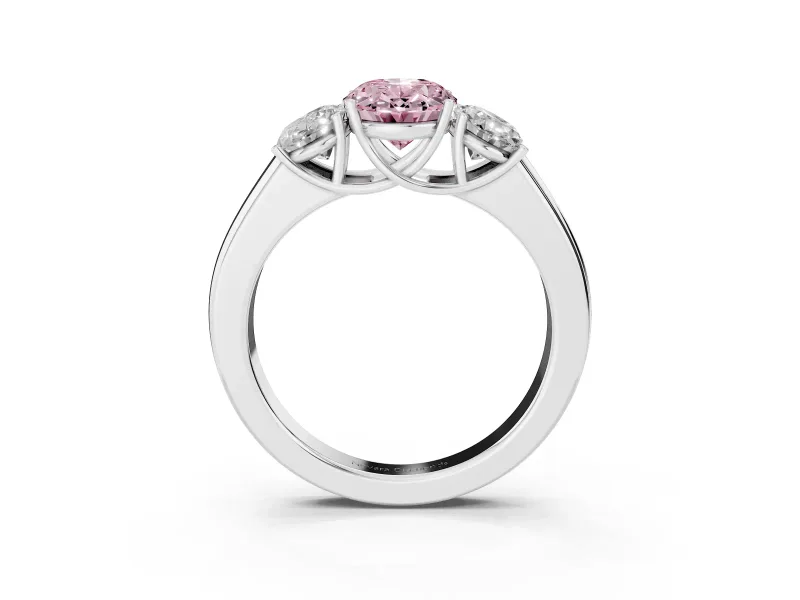 Fancy Pink Three-Stone Oval Cut Diamond Ring Set in White gold with Matching Prong Settings and Plain Band