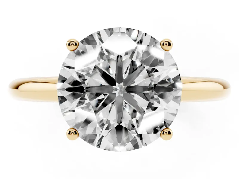 Round Cut Diamond Solitaire Engagement Ring Set in Yellow gold with Prong Setting and Polished Band