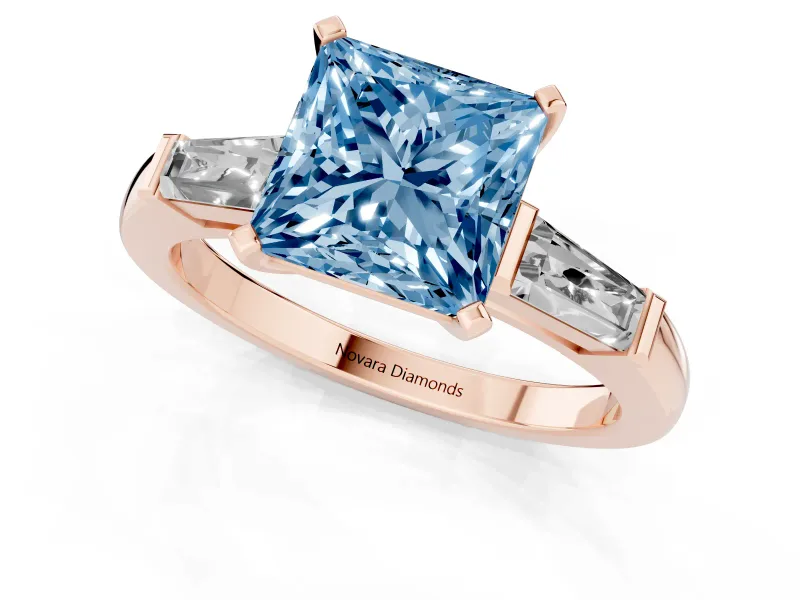 Fancy Blue Princess Cut Diamond Solitaire Ring Set in Rose gold with Tapered Baguette Side Stones and Prong Setting