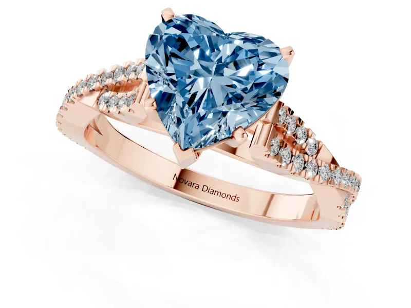 Fancy Blue Heart Cut Diamond Solitaire Engagement Ring Set in Rose gold with Twisted Pavé Band and Prong Setting