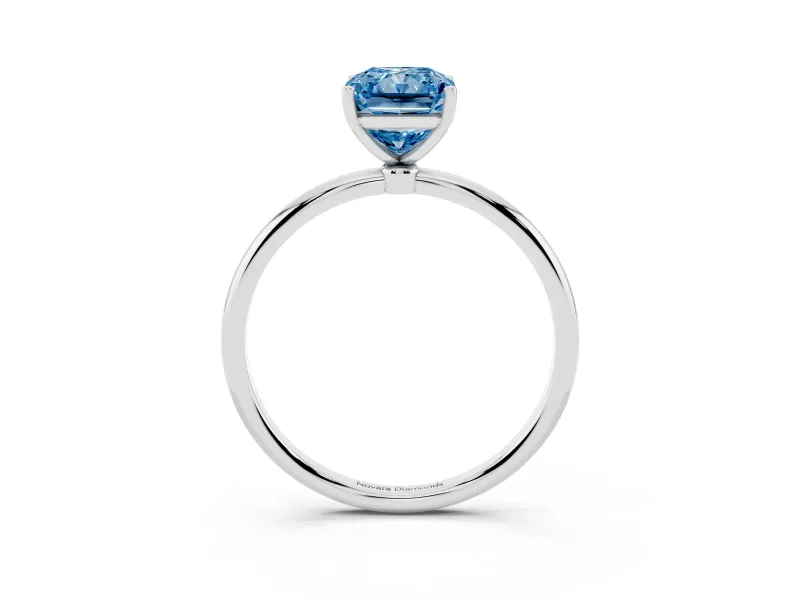 Fancy Blue Radiant Cut Diamond Solitaire Engagement Ring Set in Platinum with Thin Band and Prong Setting