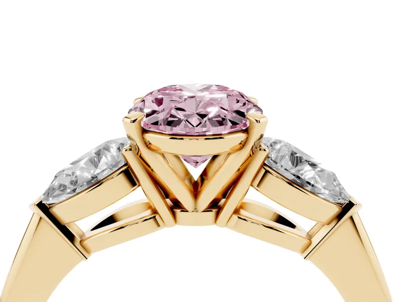 Fancy Pink Three-Stone Oval Cut Diamond Ring Set in Yellow gold with Pear Side Stones and Prong Setting