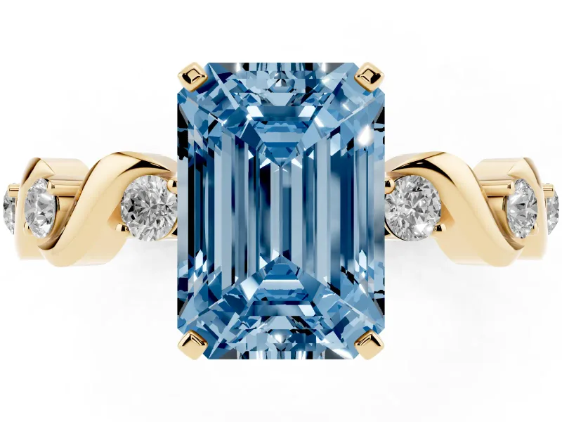 Fancy Blue Emerald Cut Diamond Solitaire Ring Set in Yellow gold with Ribbon Twist Band, Round Accents and Prong Setting