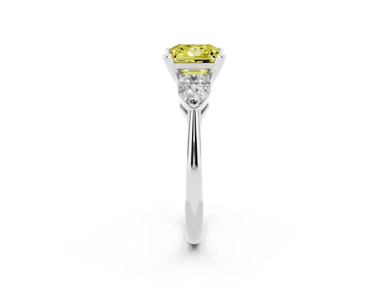 Fancy Yellow Three-Stone Princess Cut Diamond Ring Set in White gold with Pear Side Stones and Prong Setting