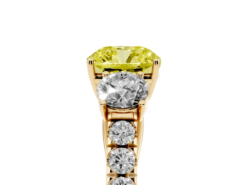 Fancy Yellow Cushion Cut Diamond Three-Stone Ring Set in Yellow gold with Round Side Stones and Delicate Pavé Band