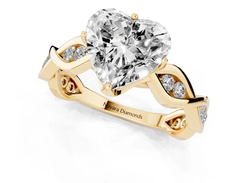 Heart Cut Diamond Twist Band Solitaire Ring Set in Yellow gold with Leaf Prong Setting and Accent Stones