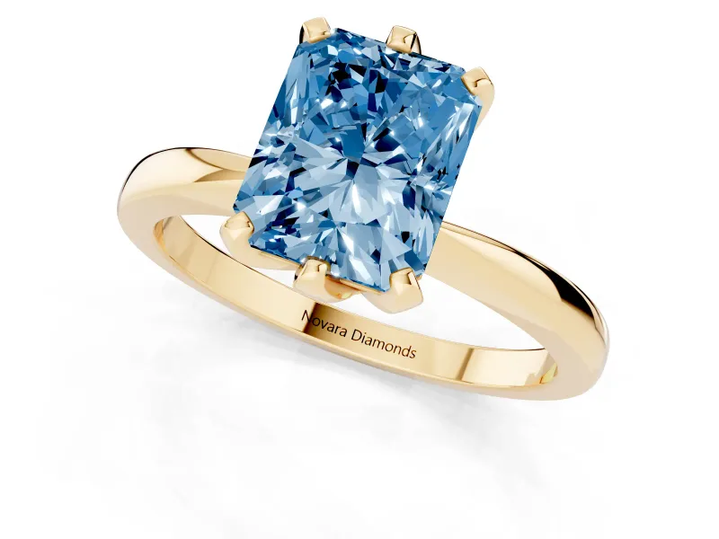 Fancy Blue Radiant Cut Diamond Solitaire Engagement Ring Set in Yellow gold with Slim Tapered Solitaire Band