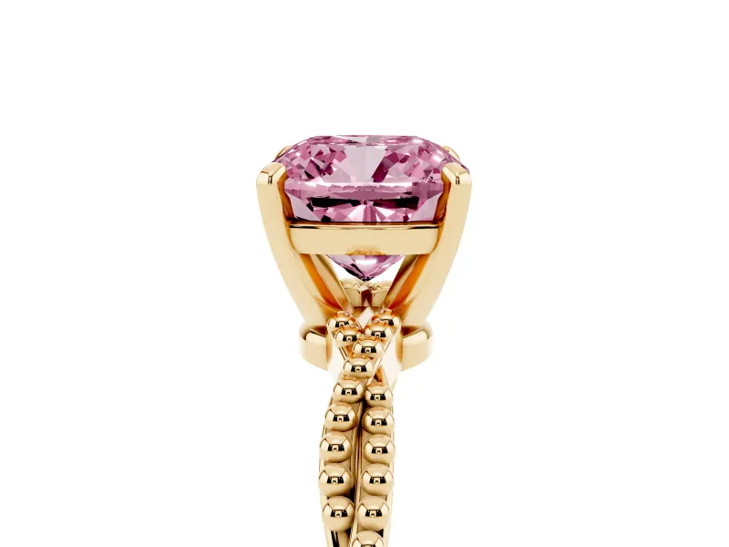 Fancy Pink Cushion Cut Diamond Solitaire Ring Set in Yellow gold with Twisted Band and Bead Prong Setting