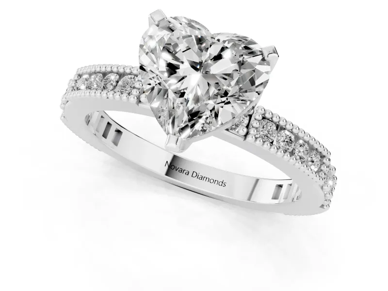 Heart Cut Diamond Solitaire Ring Set in Platinum with Slim Pavé Band and Prong Setting
