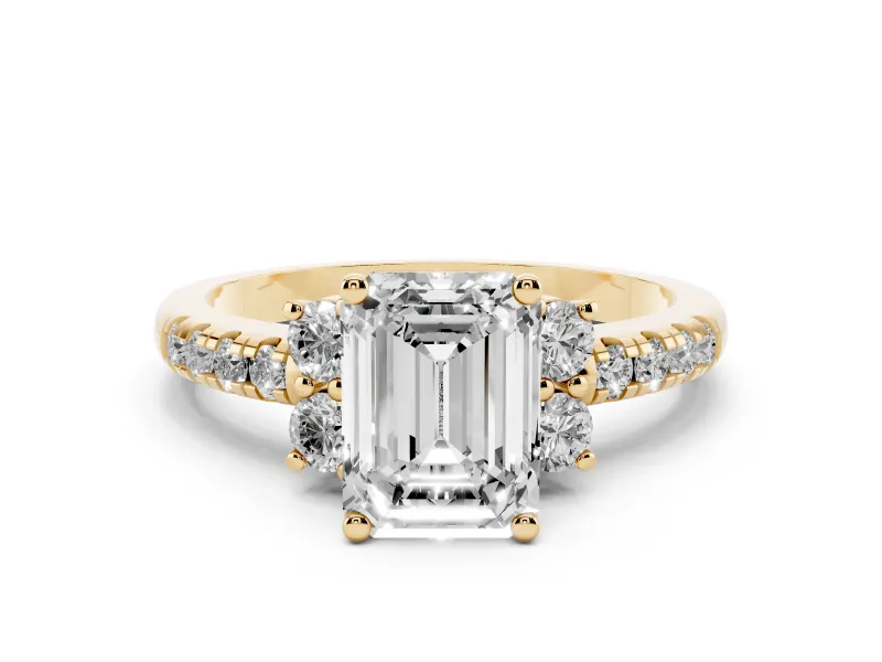 Emerald Cut Diamond Three-Stone Pavé Ring Set in Yellow gold with Prong Setting