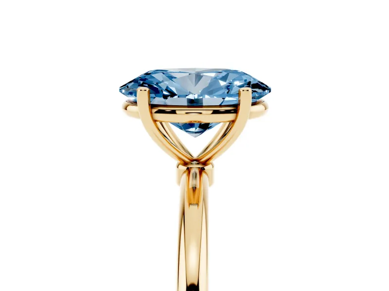 Fancy Blue Oval Cut Diamond Solitaire Engagement Ring Set in Yellow gold with Thin Band and Prong Setting
