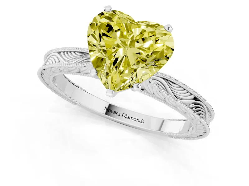 Fancy Yellow Heart Cut Diamond Solitaire Milgrain Engraved Band Set in White gold with Prong Setting