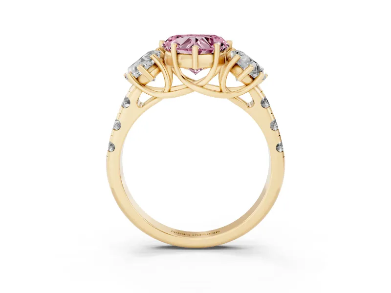 Fancy Pink Heart Cut Diamond Three-Stone Ring Set in Yellow gold with Pavé Band