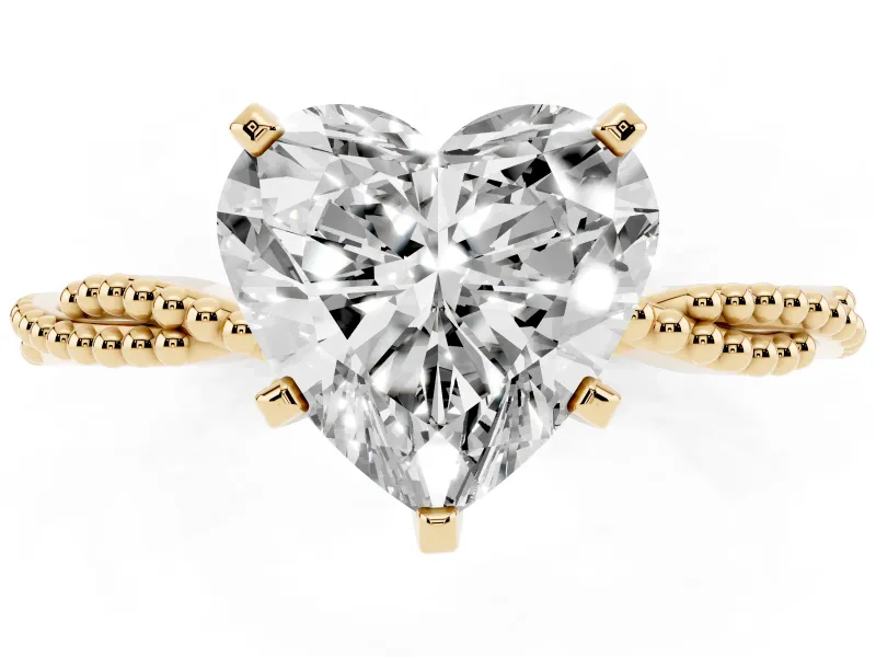 Heart Cut Diamond Solitaire Ring Set in Yellow gold with Twisted Band and Bead Prong Setting