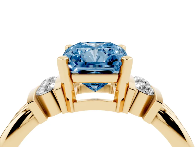 Fancy Blue Three-Stone Radiant Cut Diamond Channel Set Ring Set in Yellow gold with Bar Prongs