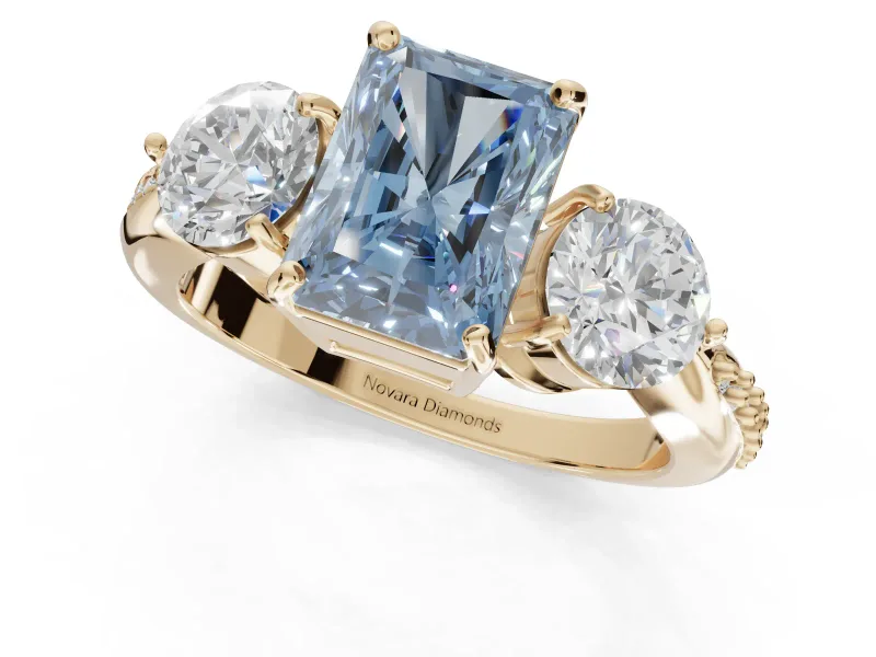 Radiant Cut Three Stone Engagement Ring Setting for a Fancy Blue Lab-Grown Diamond | Tapered Pave Band | Yellow Gold
