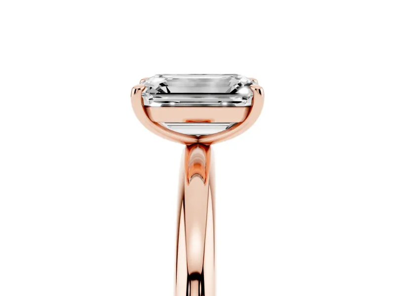 Emerald Cut Diamond Solitaire Ring Set in Rose gold with Prong Setting on a Polished Plain Band