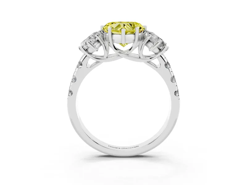Fancy Yellow Heart Cut Diamond Three-Stone Ring Set in White gold with Pavé Band