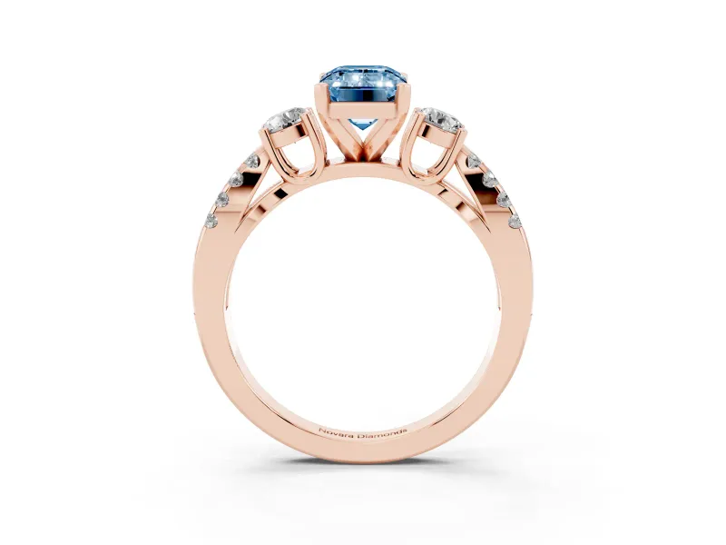 Fancy Blue Emerald Cut Diamond Three-Stone Ring Set in Rose gold with Pavé Split Shank and Prong Setting