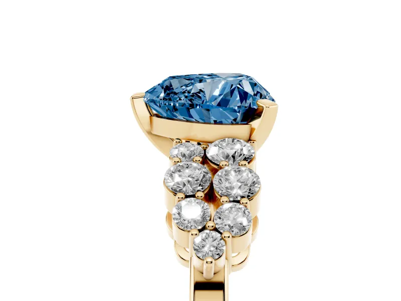 Fancy Blue Heart Cut Diamond Cluster Engagement Ring Set in Yellow gold with Pavé Band and Prong Setting