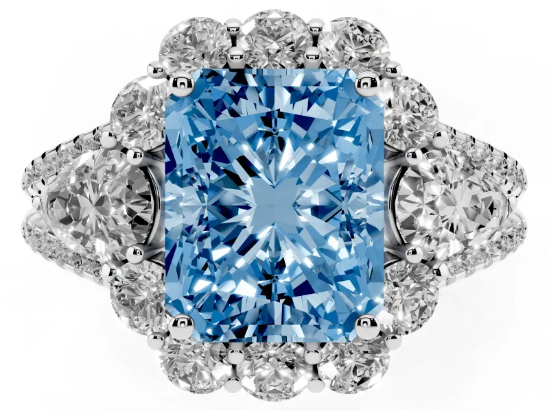 Fancy Blue Radiant Cut Diamond Halo Split Shank Engagement Ring Set in White gold with Prong-Held Center Stone