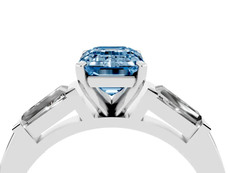 Fancy Blue Emerald Cut Diamond Solitaire Ring Set in Silver with Tapered Baguette Side Stones and Prong Setting