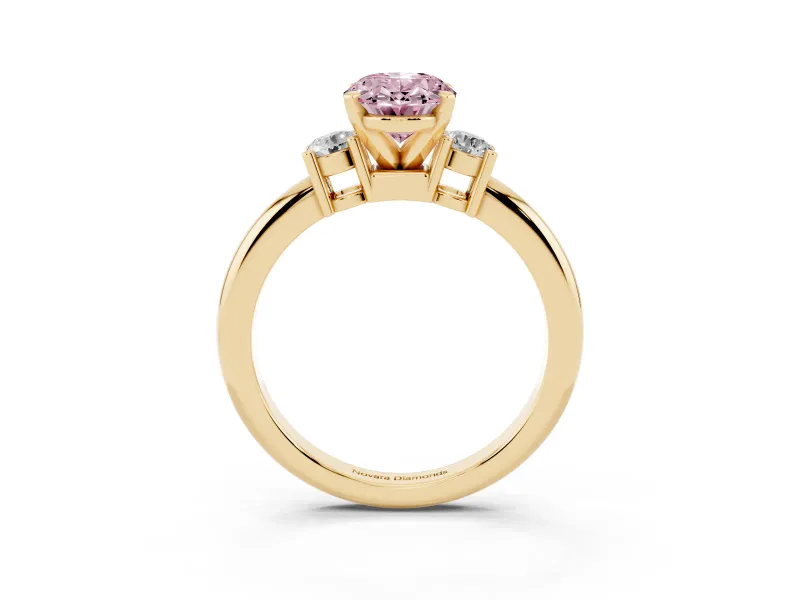 Fancy Pink Three-Stone Oval Cut Diamond Ring Set in Yellow gold with Prong Setting and Plain Band