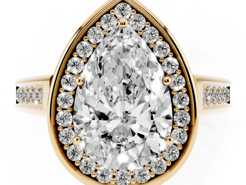 Pear Cut Diamond Halo Solitaire Ring Set in Yellow gold with Pavé Band and Bezel Setting