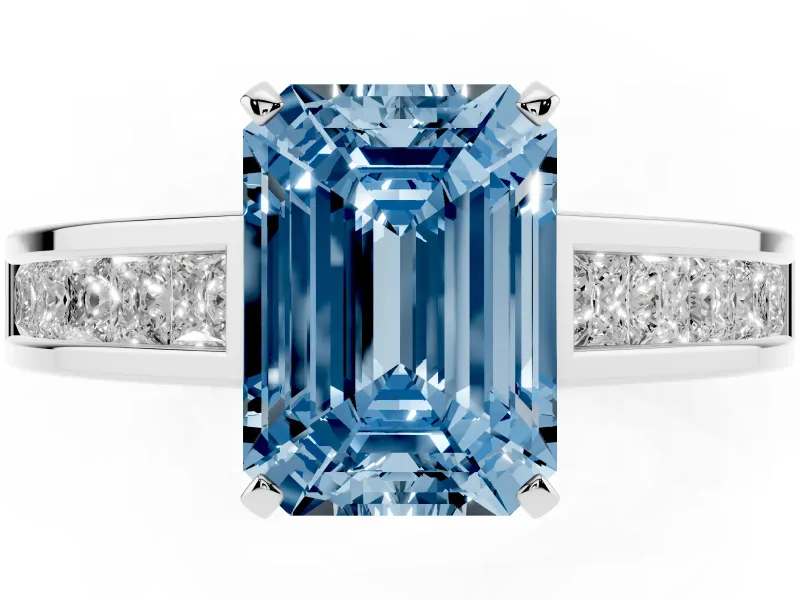 Fancy Blue Emerald Cut Diamond Solitaire Ring Set in Silver with Channel-Set Band and Prong Setting
