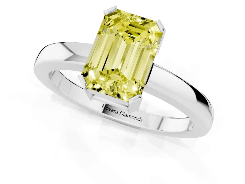 Fancy Yellow Emerald Cut Diamond Solitaire Ring Set in Platinum with Prong Head and Smooth Polished Band