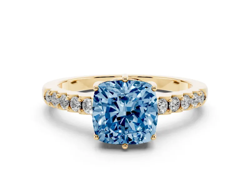 Fancy Blue Cushion Cut Diamond Solitaire Engagement Ring Set in Yellow gold with Pavé Band and Prong Setting