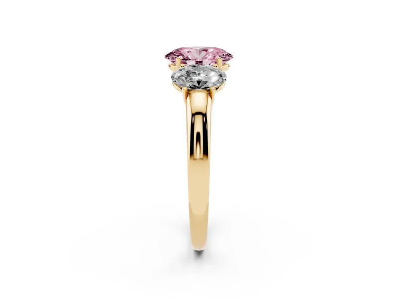 Fancy Pink Oval Cut Diamond Three-Stone Ring Set in Yellow gold with Bold Center and Classic Band