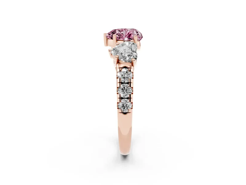 Fancy Pink Heart Cut Diamond Three-Stone Ring Set in Rose gold with Pavé Band