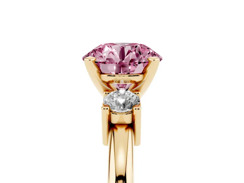 Fancy Pink Three-Stone Round Cut Diamond Ring Set in Yellow gold with Prong Setting and Plain Band