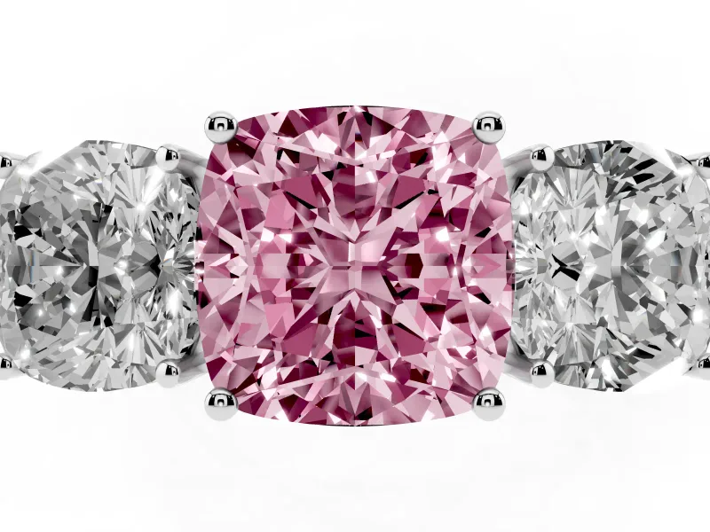 Fancy Pink Cushion Cut Diamond Three-Stone Ring Set in Silver with Textured Band