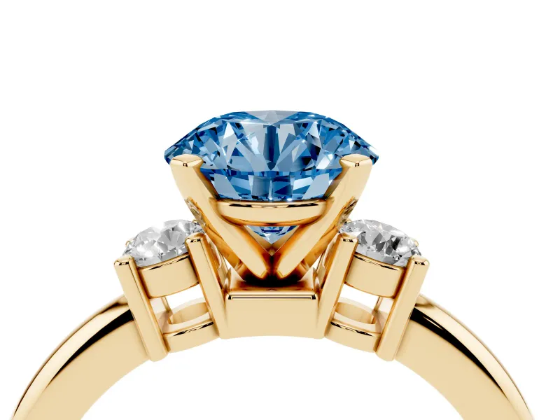 Fancy Blue Three-Stone Round Cut Diamond Ring Set in Yellow gold with Prong Setting and Plain Band