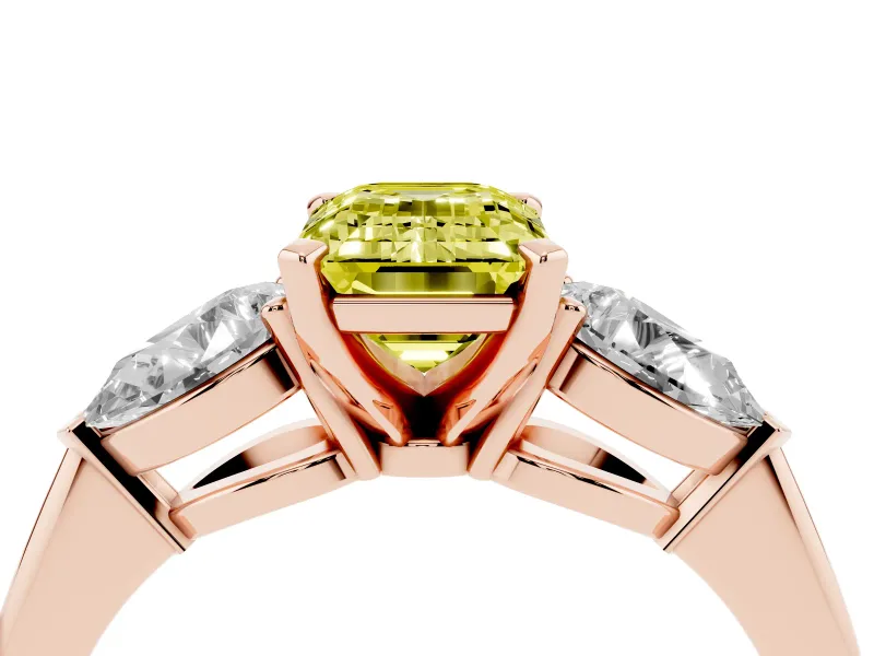 Fancy Yellow Three-Stone Emerald Cut Diamond Ring Set in Rose gold with Pear Side Stones and Prong Setting