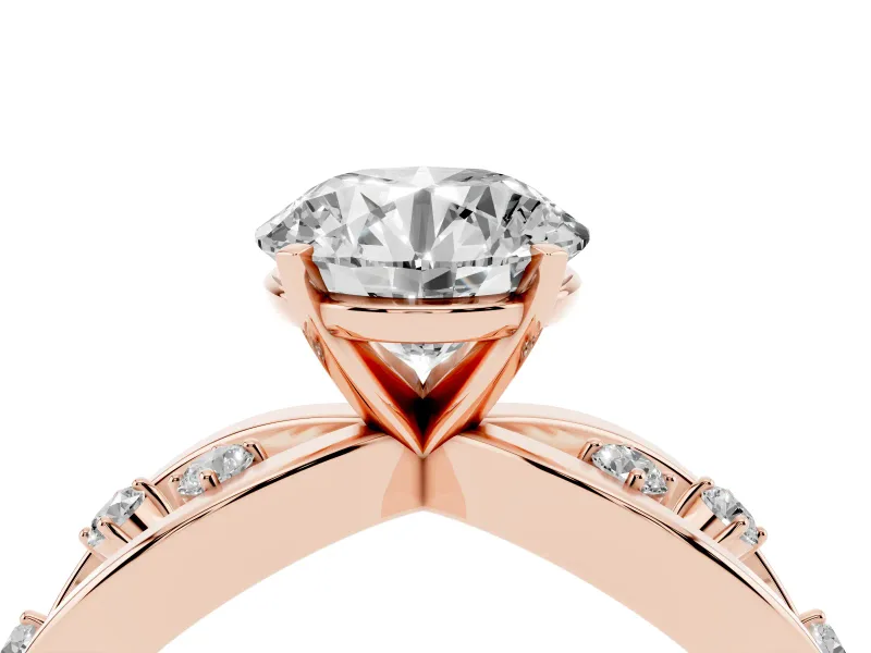 Round Cut Diamond Solitaire Ring Set in Rose gold with Side Stones on Criss-Cross Band and Prong Setting
